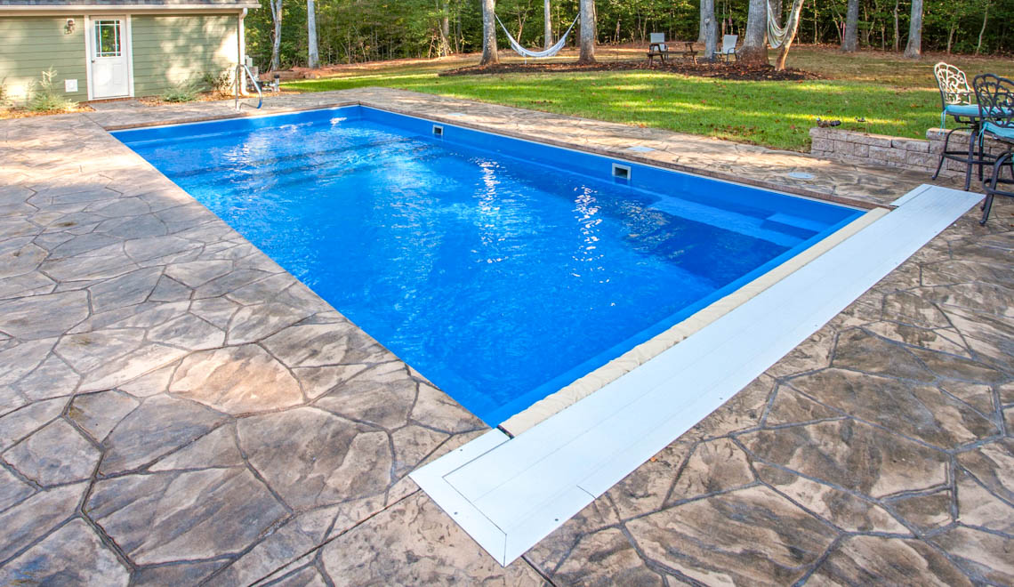 Leisure Pools Pinnacle large composite swimming pool with built-in splash deck