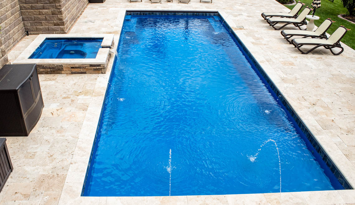 Leisure Pools Supreme composite fiberglass swimming pool with deep bench seats