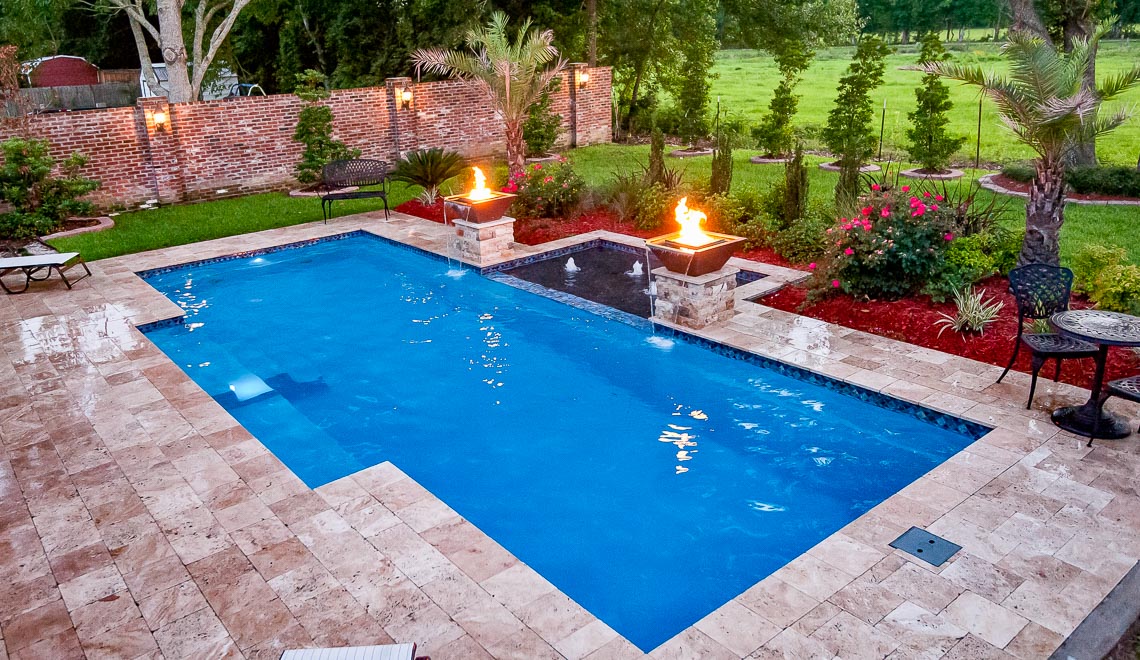 Leisure Pools Elegance fiberglass swimming pool with built-in steps