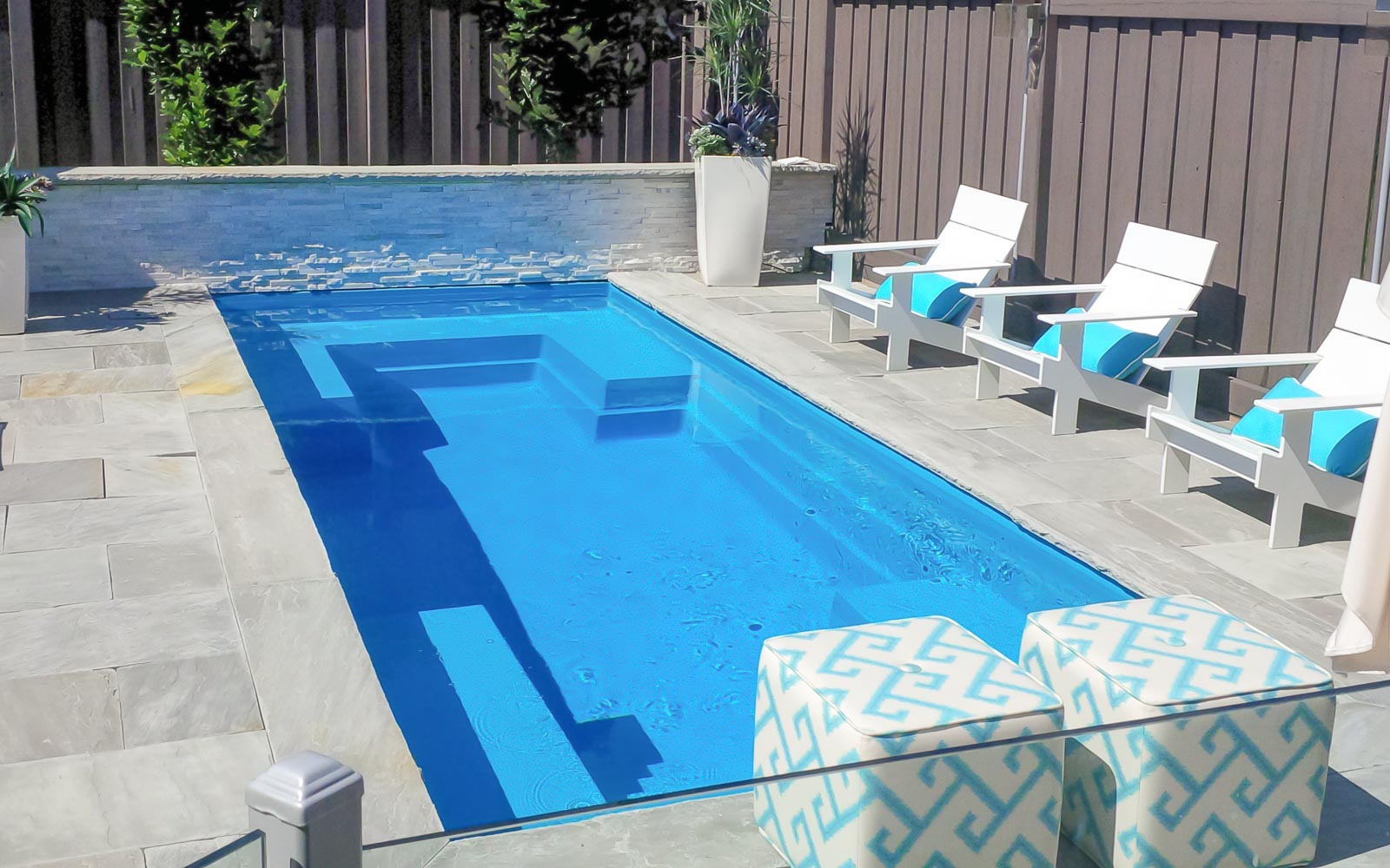 Leisure Pools Palladium Plunge fiberglass swimming pool with built-in bench