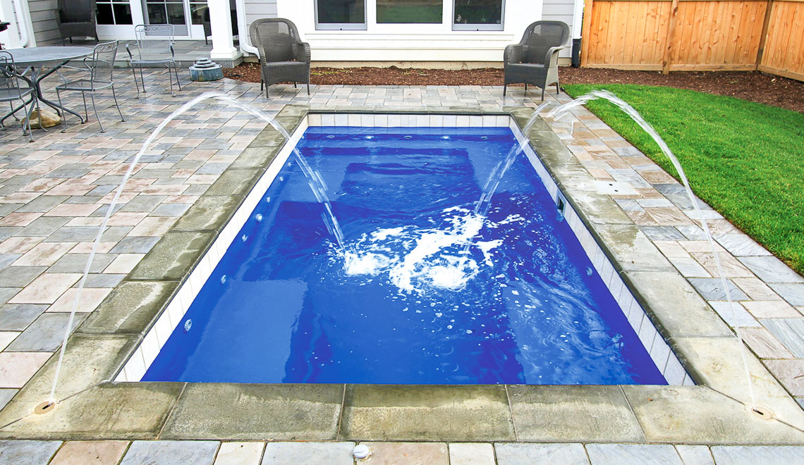 Leisure Pools Palladium Plunge composite in-ground swimming pool with wrapped bench area