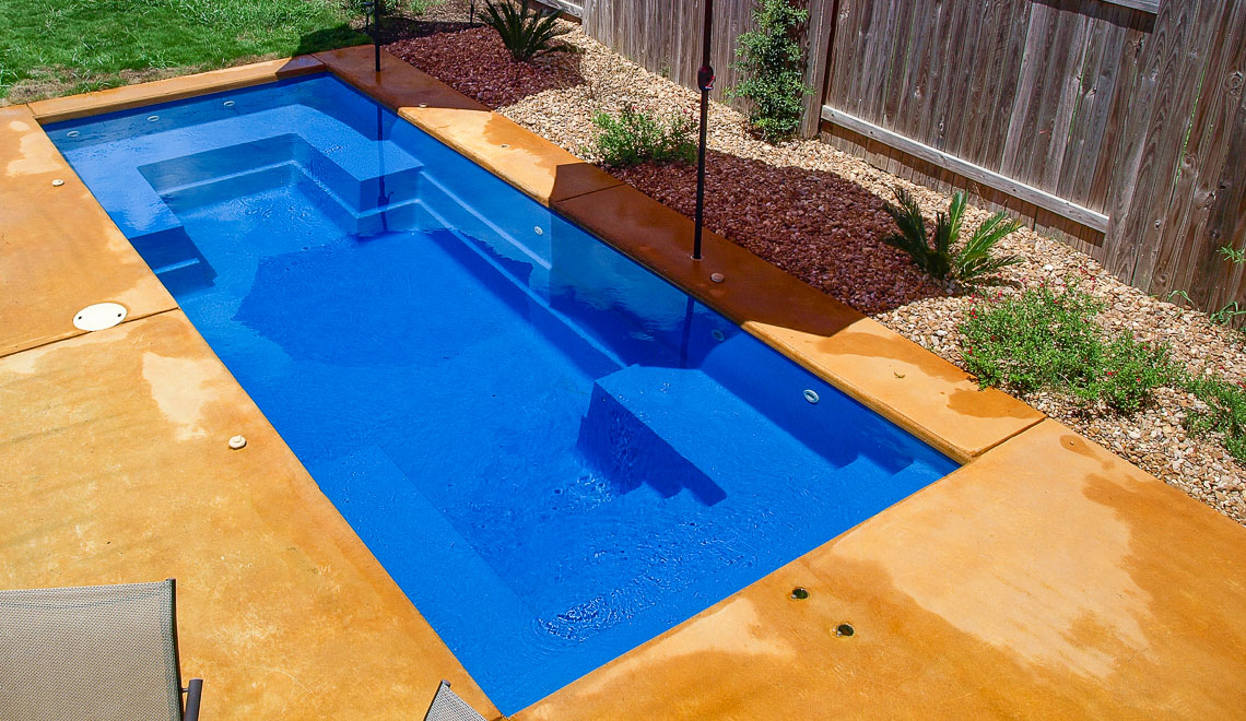 Leisure Pools Palladium Plunge composite swimming pool with wraparound bench and built-in steps