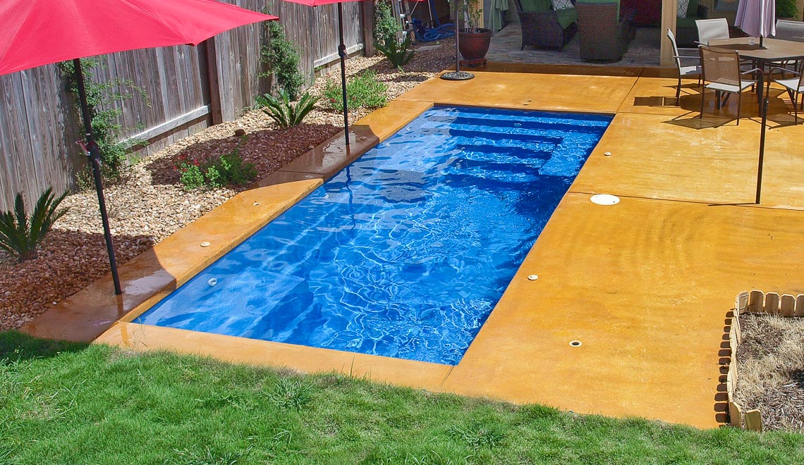 Leisure Pools Palladium Plunge composite swimming pool with wrapped bench area