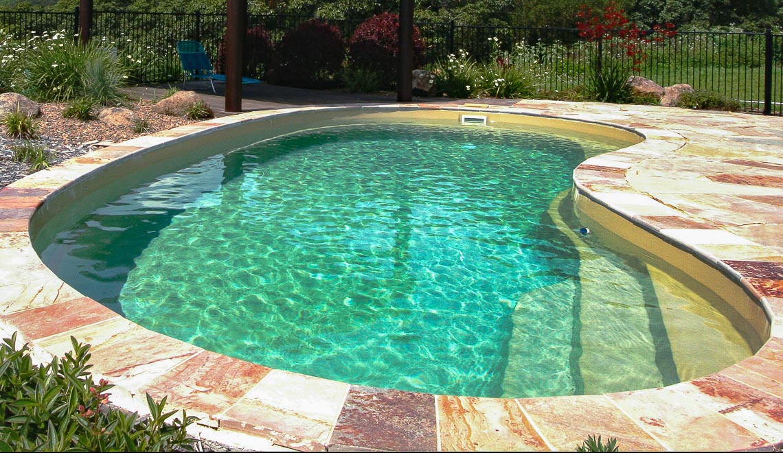 Leisure Pools Tuscany composite fiberglass swimming pool with built-in entry and exit steps