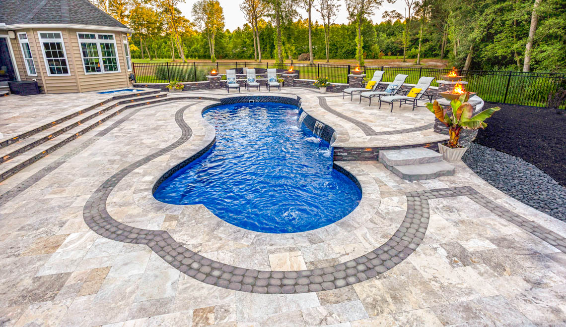 Leisure Pools Eclipse in-ground fiberglass swimming pool with built-in splash deck