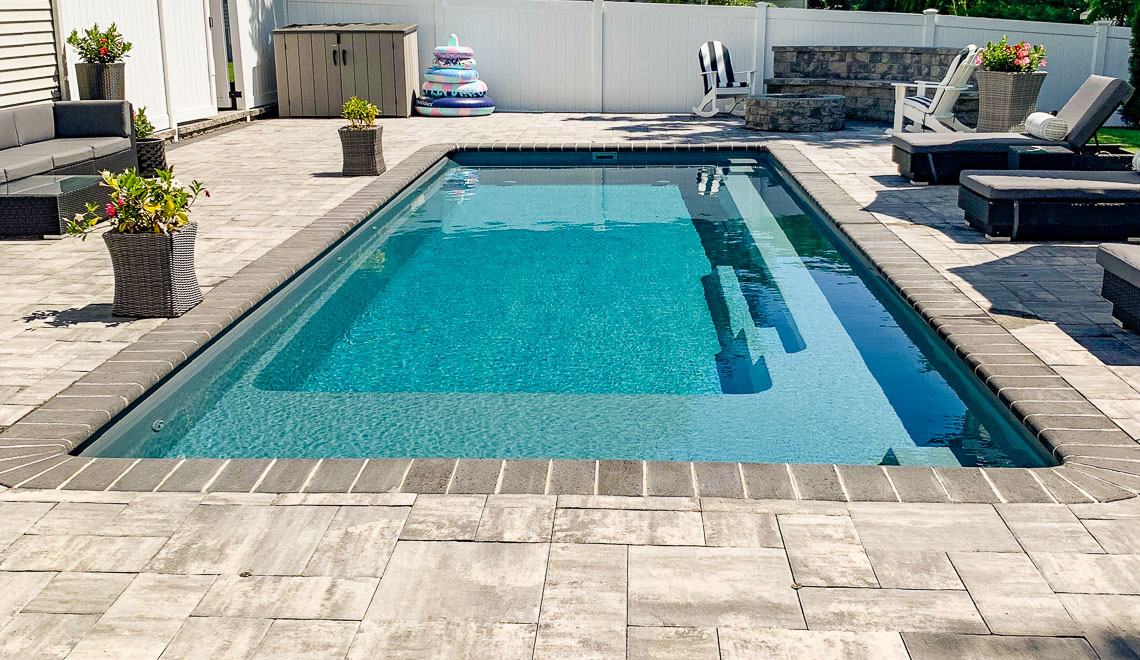 Leisure Pools Reflection with Splash Desk composite fiberglass swimming pool