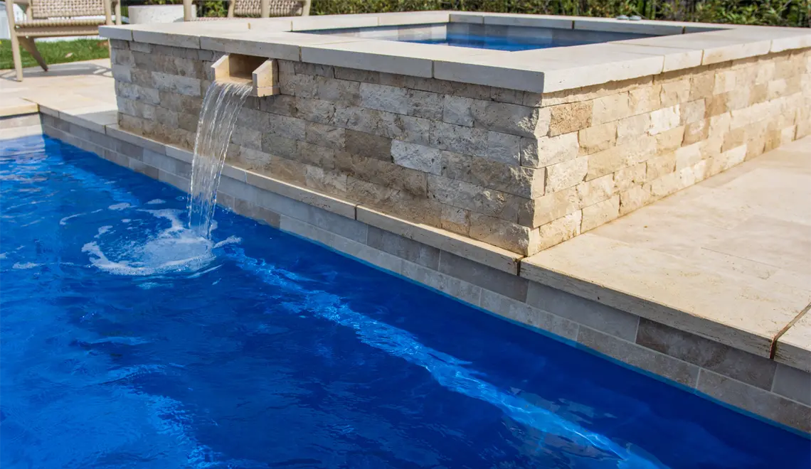 Leisure Pools Pinnacle Fiberglass Best Swimming Pool spa and fountain rectangular shape.