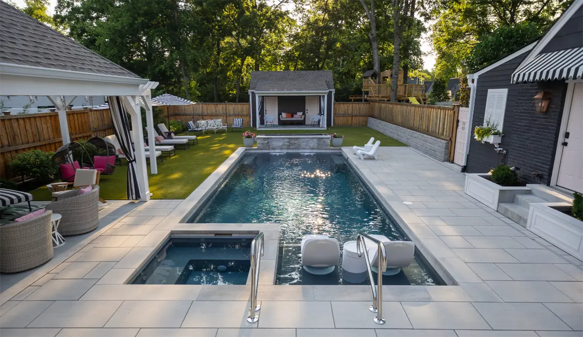 Leisure Pools Ultimate Fiberglass Best Swimming Pool evening narrow end.